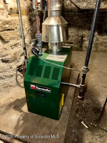 a picture of a room with a floor to ceiling fan