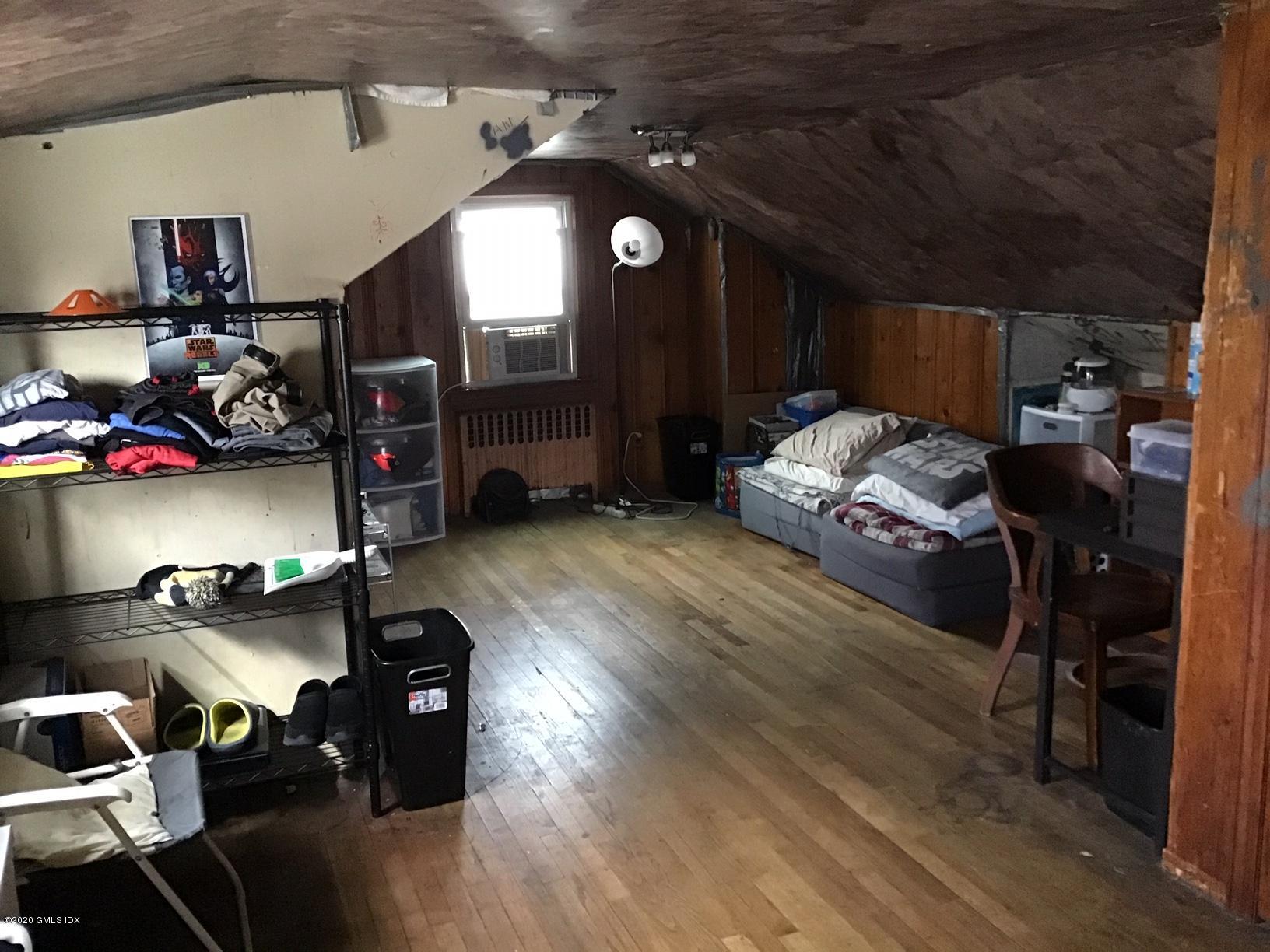 36 Sheep Hill Road Riverside, CT 06878 - Photo 11 of 16 a living room with furniture and a gym machine