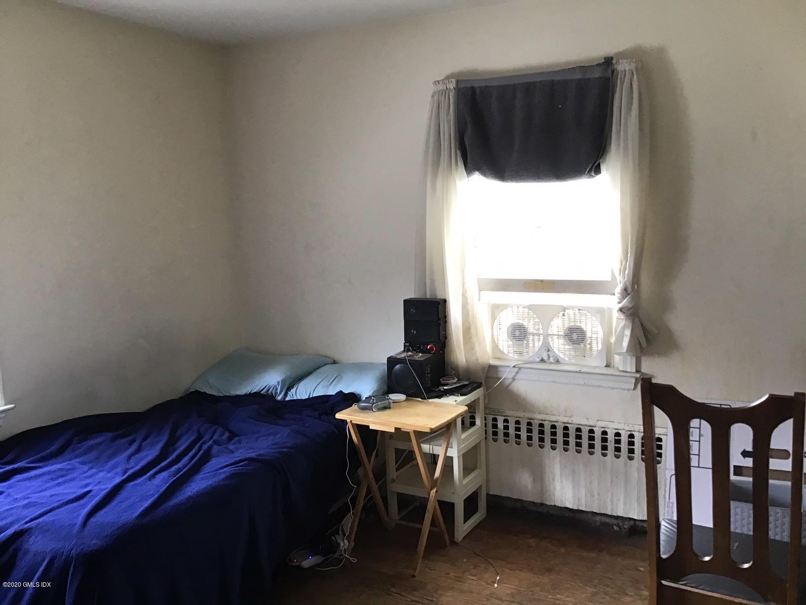 36 Sheep Hill Road Riverside, CT 06878 - Photo 12 of 16 a bedroom with a bed and a window