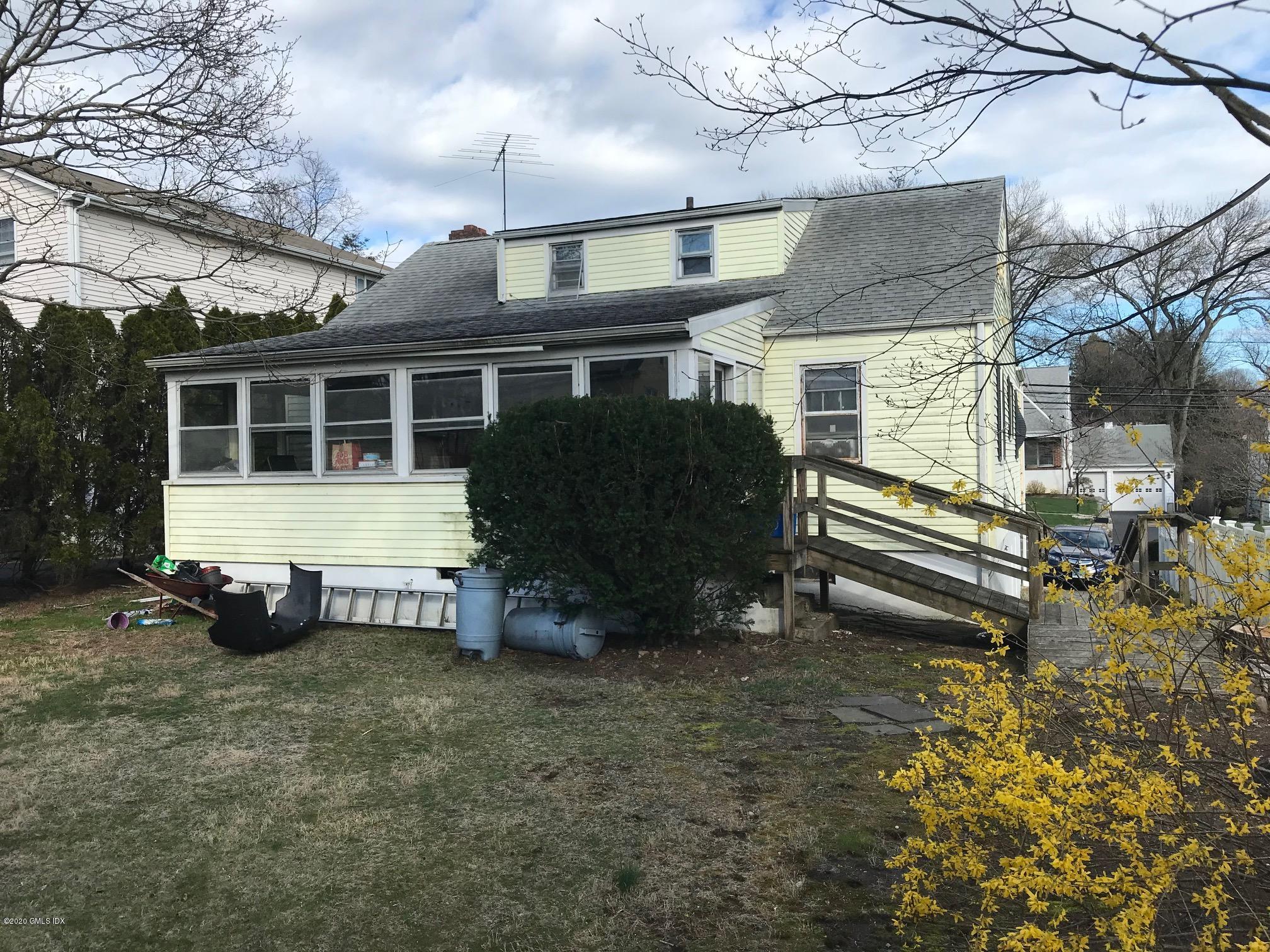 36 Sheep Hill Road Riverside, CT 06878 - Photo 14 of 16 a view of a house with a yard and sitting area