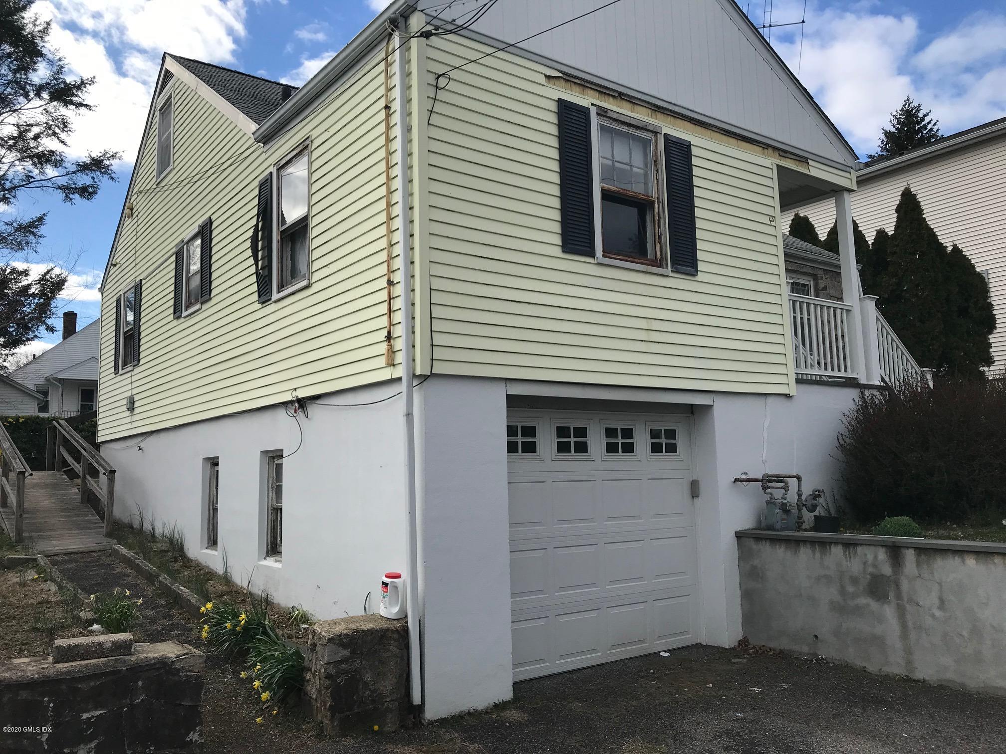 36 Sheep Hill Road Riverside, CT 06878 - Photo 3 of 16 a view of a house with a garage