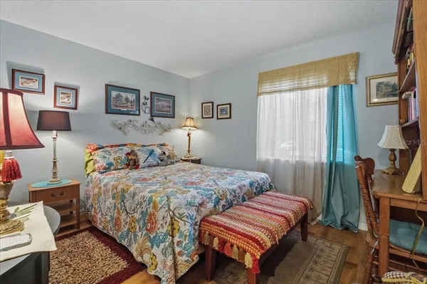 a bedroom with a bed and a couch