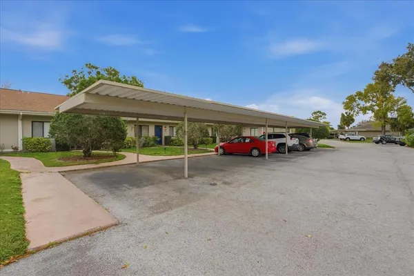 a view of a car parked in front of a house