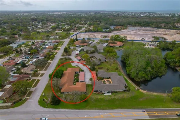 an aerial view of residential houses with outdoor space