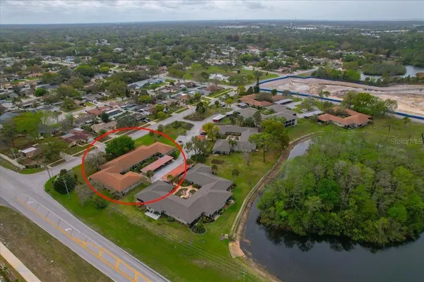 an aerial view of residential houses with outdoor space