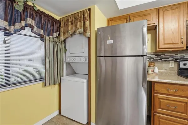 a white refrigerator freezer and a microwave