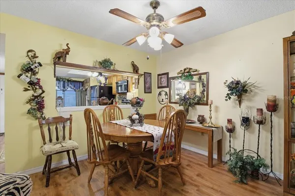 a view of a dining room with furniture and chandelier