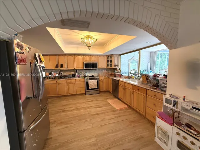 a kitchen with a table and chairs