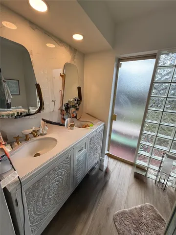 a white toilet sitting next to a bath tub shower