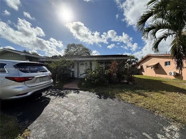 a car parked in front of a house