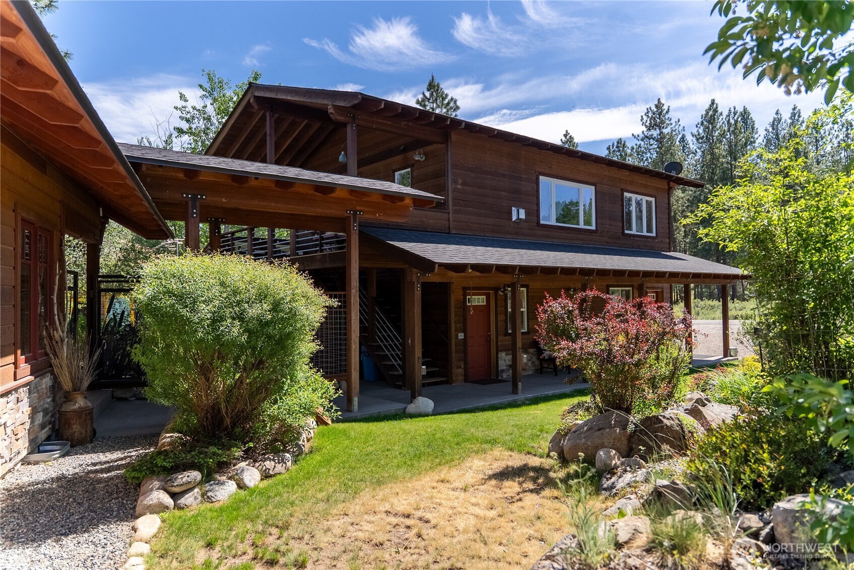 130 Sundown Road Winthrop, WA 98862 - Photo 2 of 40 a view of a house that has a small garden