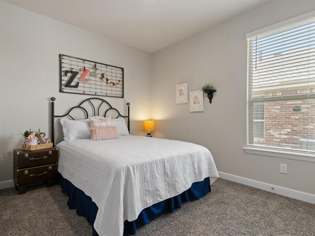 270 Lunayena Road Rhome, TX 76078 - Photo 6 of 37 The guest bedroom offers a comfortable and versatile space with natural light and a closet, making it ideal for family, overnight guests, or a home office to fit your lifestyle.