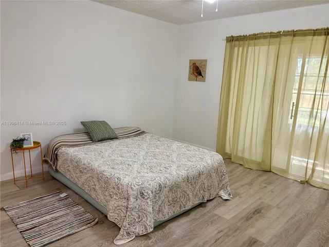 a view of hallway with wooden floor