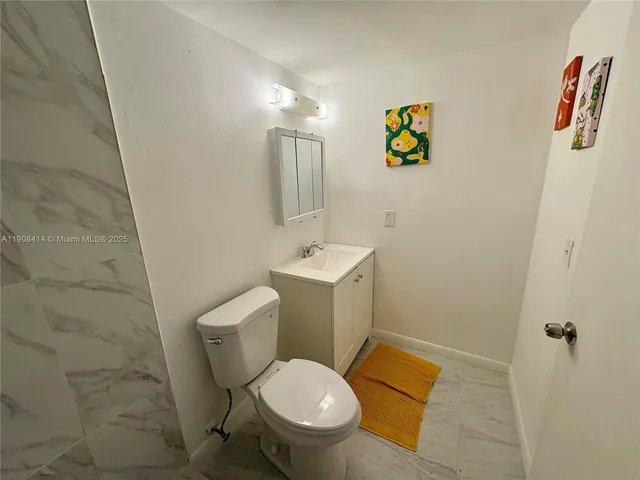 a bathroom with a toilet and a sink