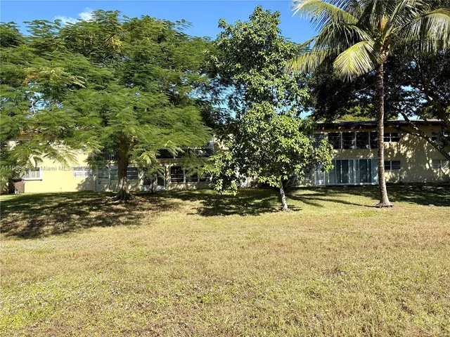 a view of a chairs and table in the patio