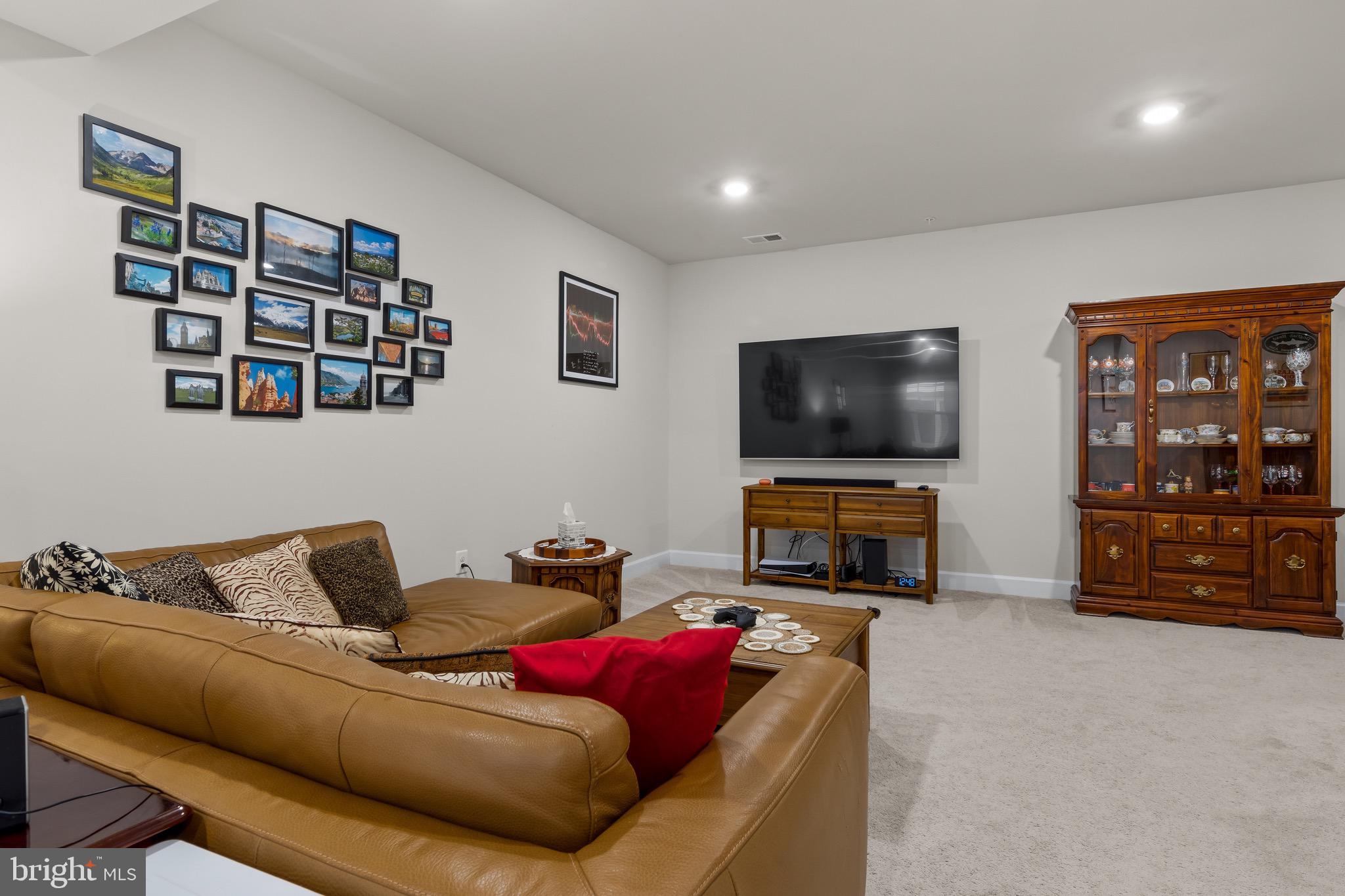 734 Quarry Point Road Malvern, PA 19355 - Photo 25 of 32 a living room with furniture and a flat screen tv