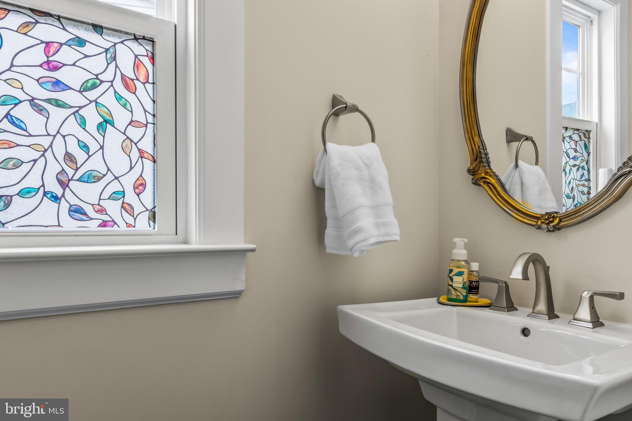734 Quarry Point Road Malvern, PA 19355 - Photo 29 of 32 a bathroom with a sink and a mirror