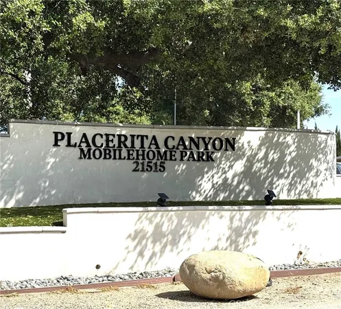 a view of outdoor space with a garden and trees