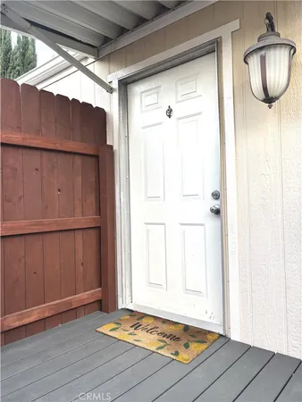 a view of room with window and wooden floor