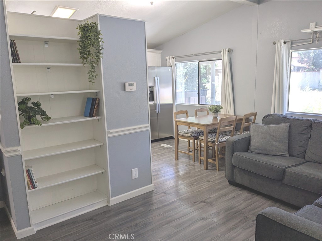 21515 Placerita Canyon Road, Unit 26 Newhall, CA 91321 - Photo 8 of 19 a living room with furniture and a large window