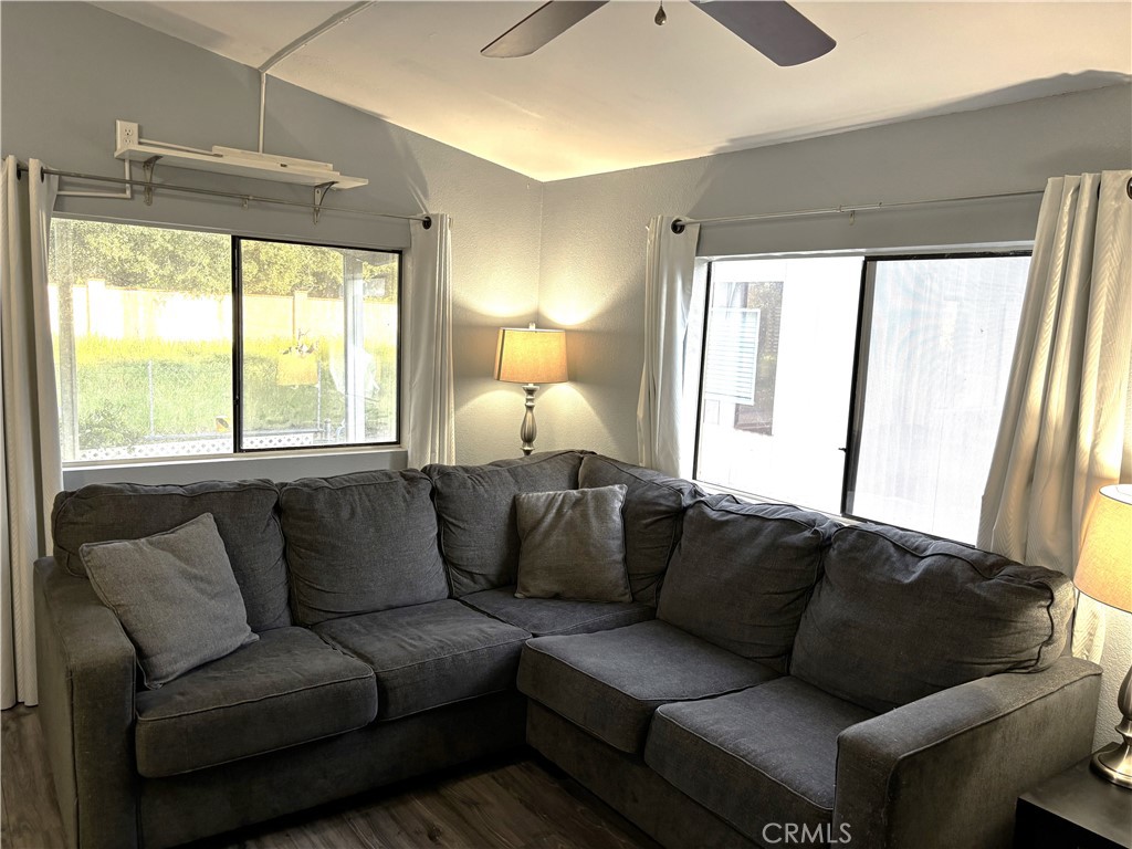 21515 Placerita Canyon Road, Unit 26 Newhall, CA 91321 - Photo 9 of 19 a living room with furniture and a large window