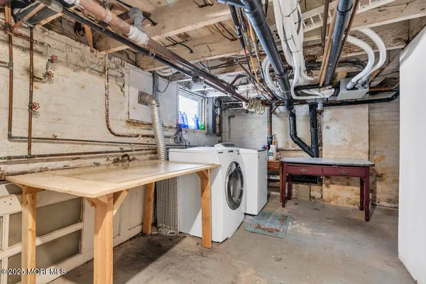 a view of a porch with a table and chairs