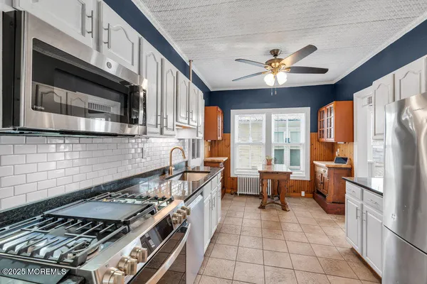 a view of a hallway to rooms and stairs