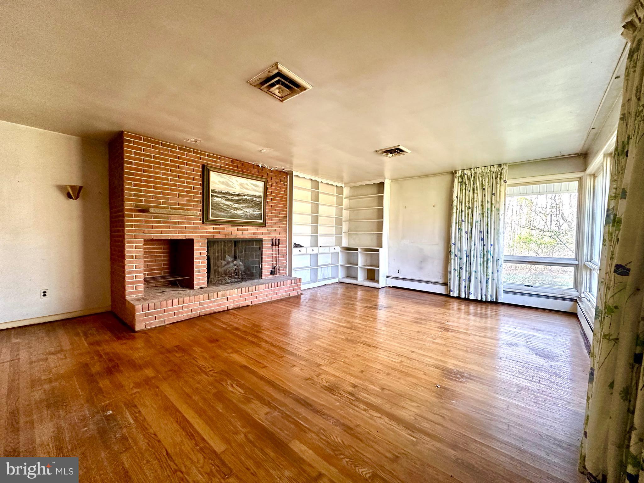 4405 Meadowcliff Road Glen Arm, MD 21057 - Photo 12 of 54 Living Room with brick fireplace