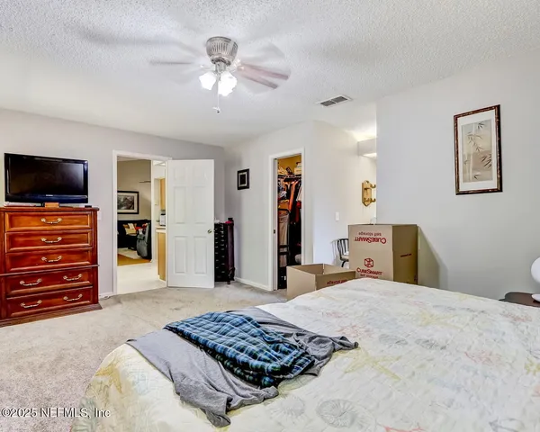 a bedroom with a bed and furniture