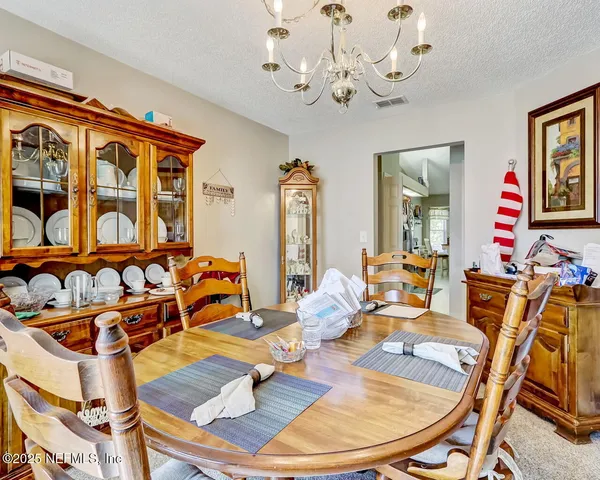 a living room with fireplace furniture and a wooden floor