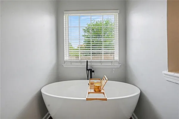 a white bath tub sitting in a bathroom