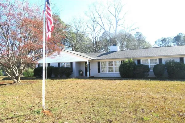 a front view of a house with yard
