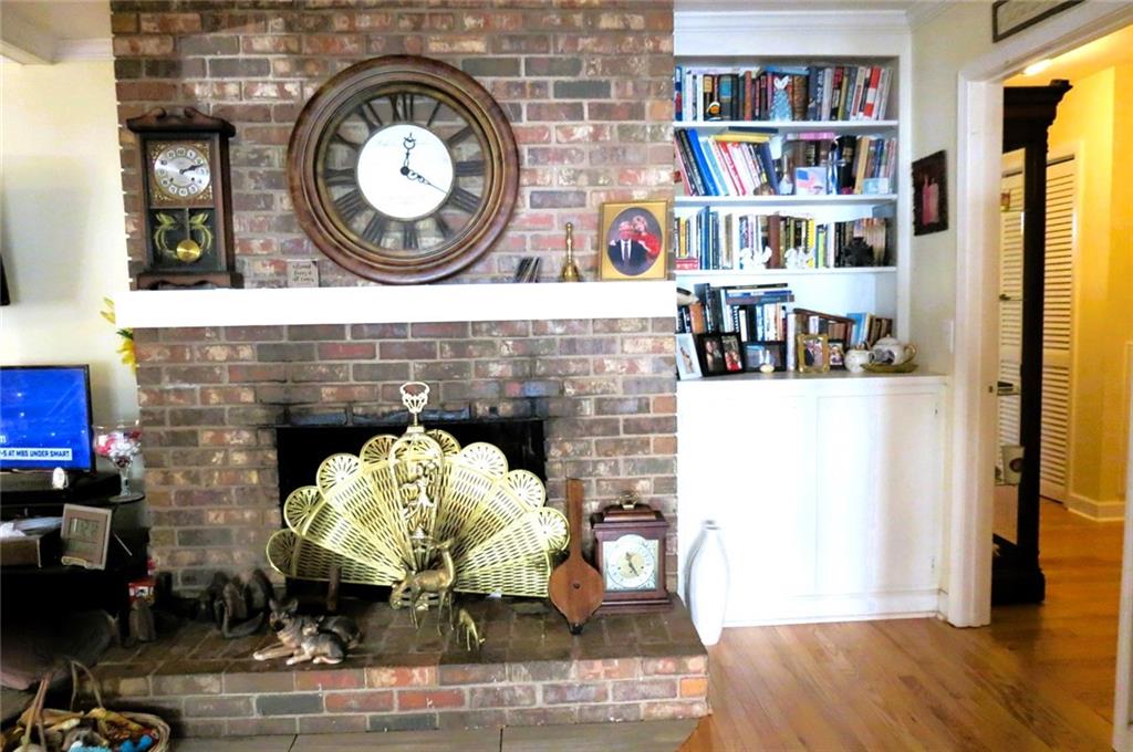4880 Pea Ridge Road Cornelia, GA 30531 - Photo 12 of 34 a living room with furniture and a fireplace