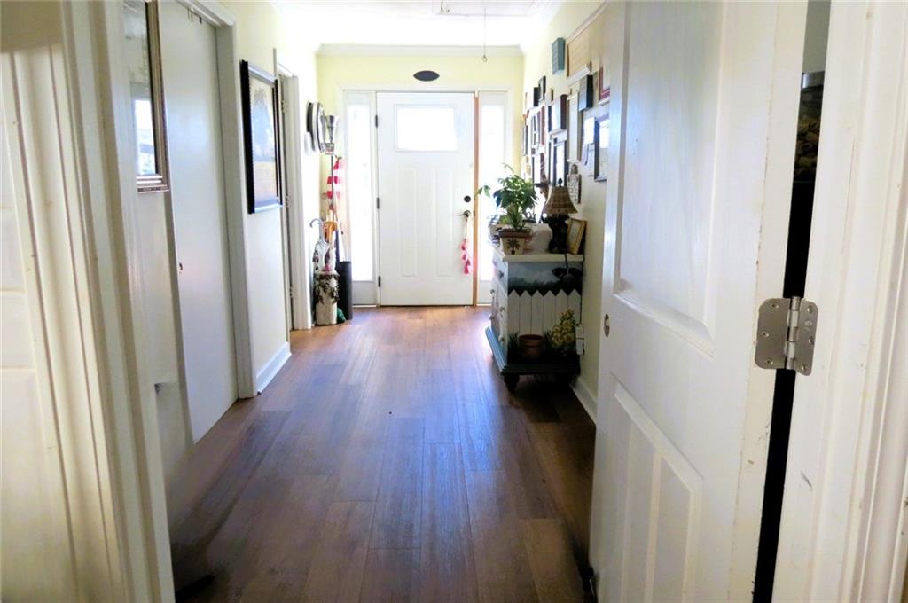 4880 Pea Ridge Road Cornelia, GA 30531 - Photo 15 of 34 a view of a hallway with wooden floor and stairs