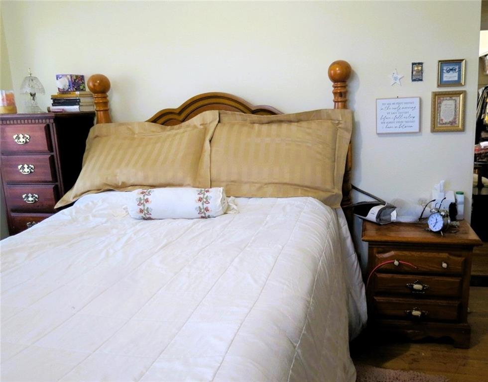 4880 Pea Ridge Road Cornelia, GA 30531 - Photo 19 of 34 a bedroom with a bed and a dresser