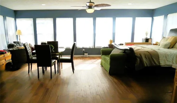 a bed room with a bed window and a couch