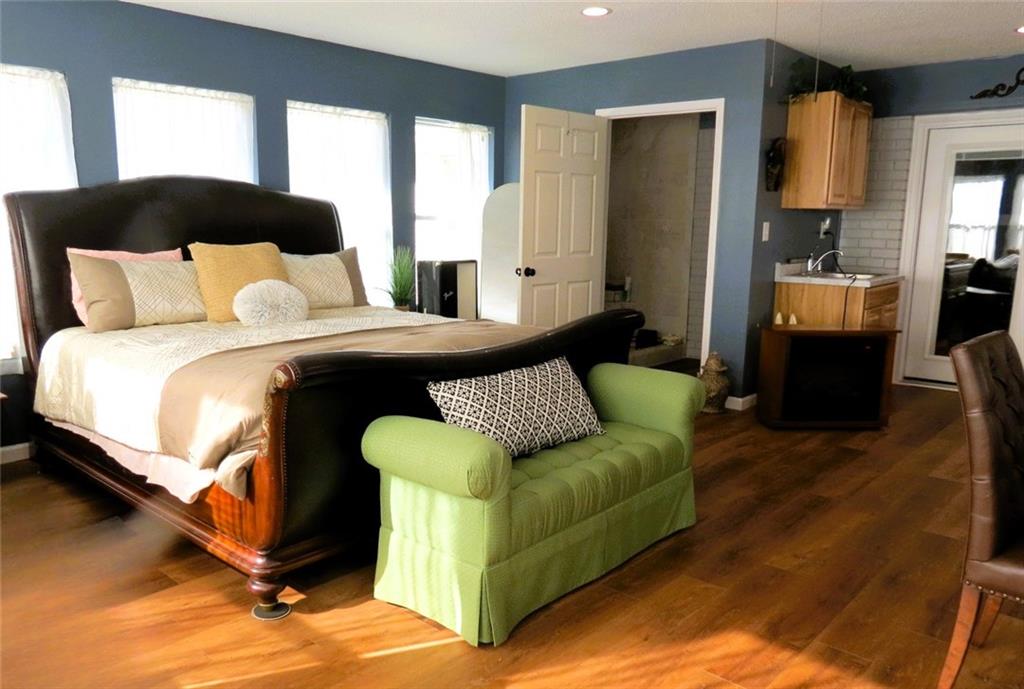 4880 Pea Ridge Road Cornelia, GA 30531 - Photo 23 of 34 a bed room with a bed window and a couch