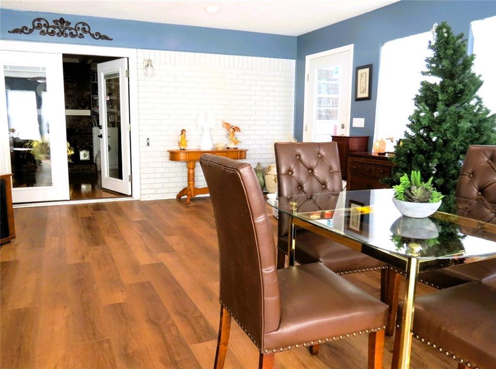 4880 Pea Ridge Road Cornelia, GA 30531 - Photo 25 of 34 a dining room with furniture and wooden floor