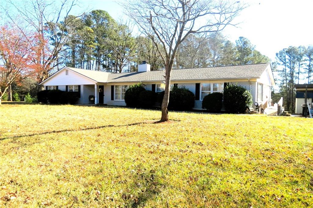 4880 Pea Ridge Road Cornelia, GA 30531 - Photo 30 of 34 a view of a white house with a yard