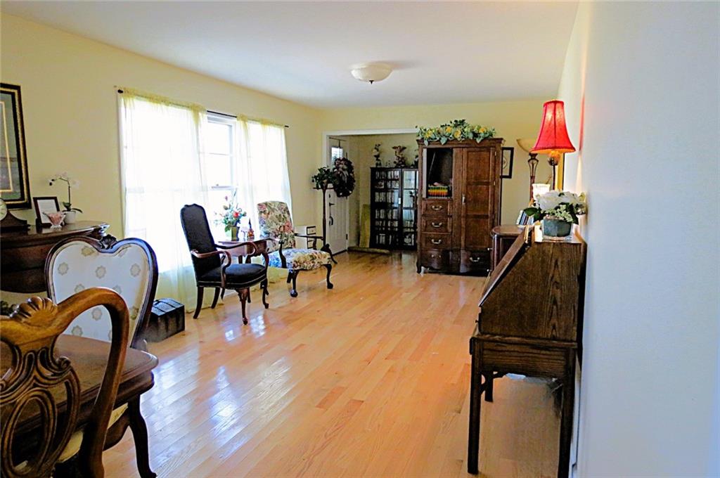 4880 Pea Ridge Road Cornelia, GA 30531 - Photo 3 of 34 a living room with furniture a rug and gym equipment