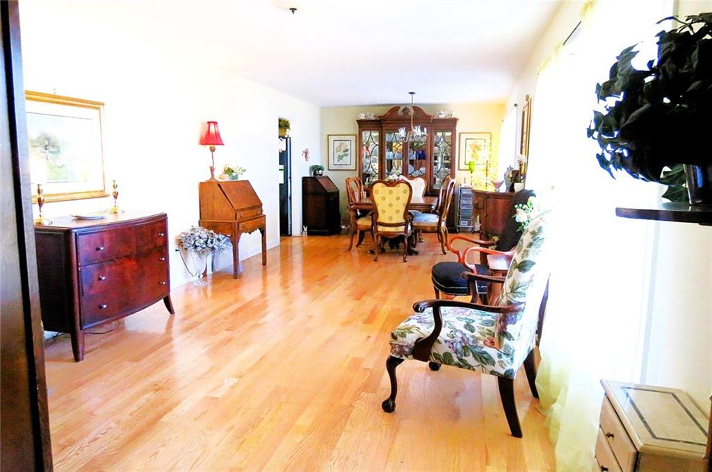 4880 Pea Ridge Road Cornelia, GA 30531 - Photo 4 of 34 a living room with furniture and a flat screen tv