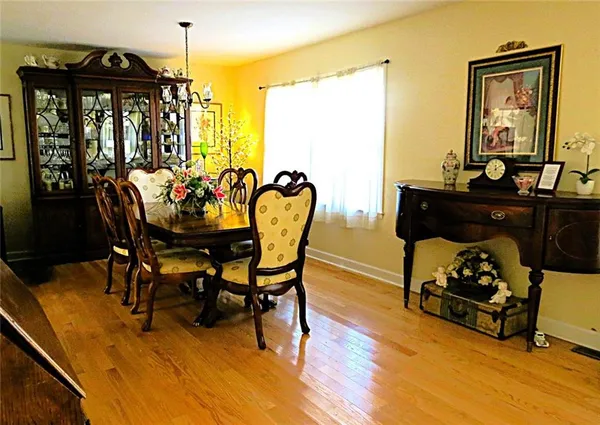 a view of a dining room with furniture and window
