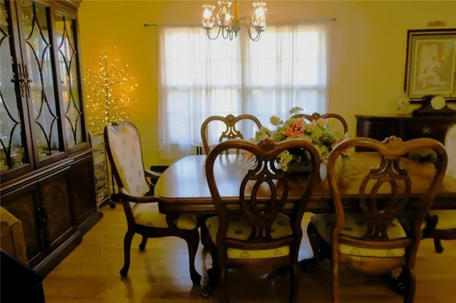 a view of a dining room with furniture and window