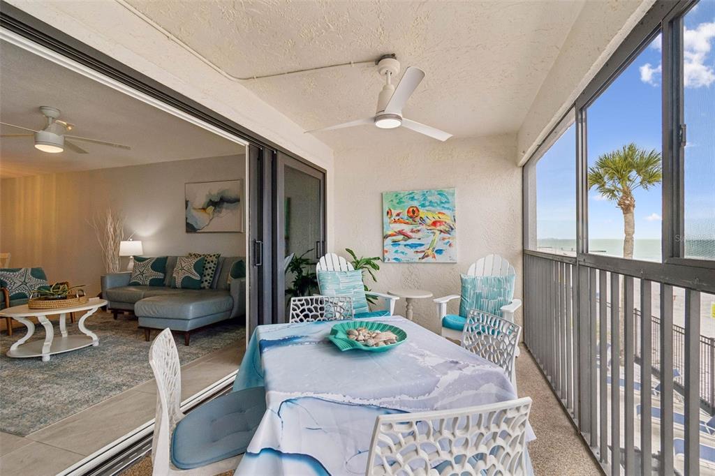 14600 Gulf Boulevard, Unit 102 Madeira Beach, FL 33708 - Photo 29 of 46 a living room with furniture and a table