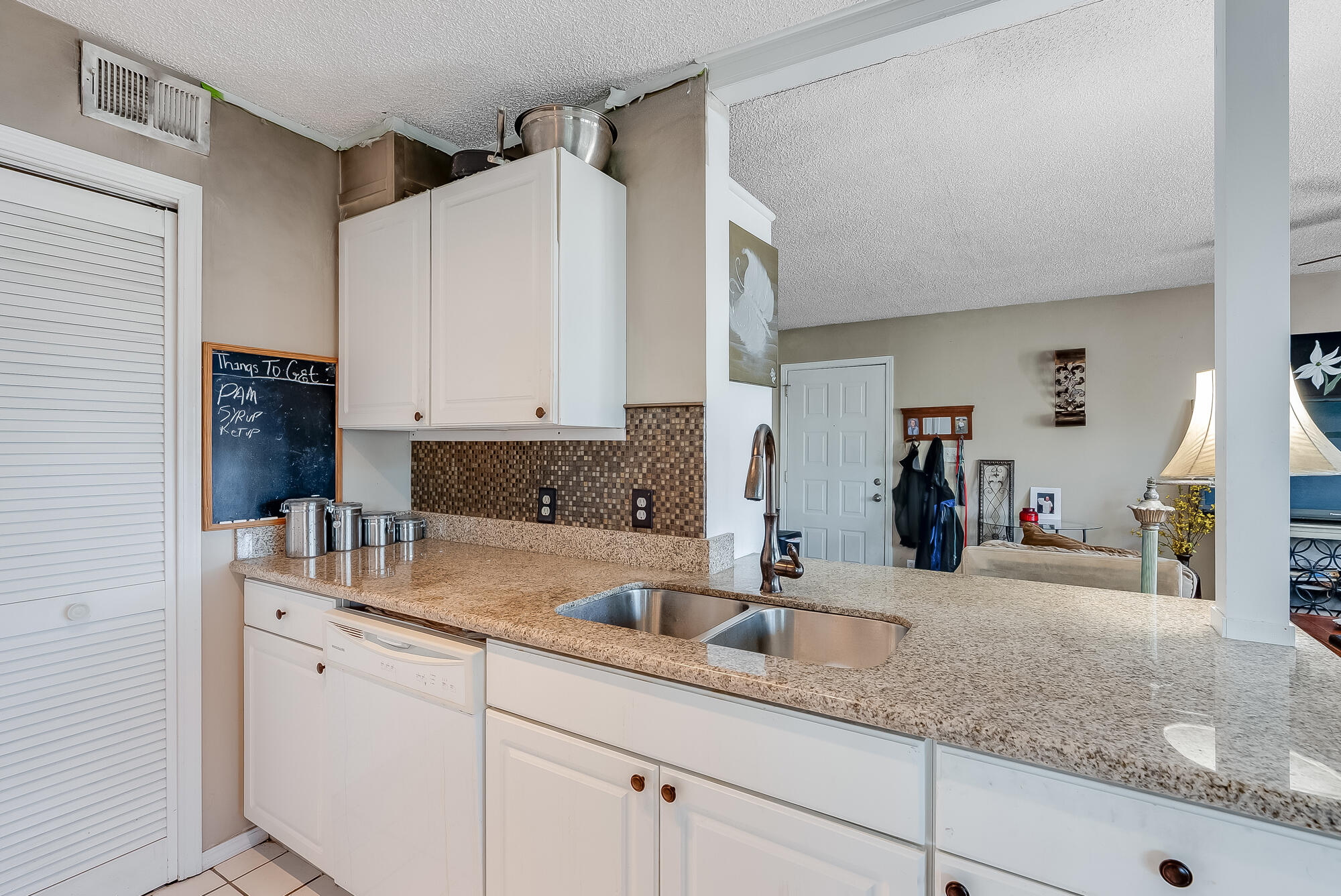 200 Pensacola Beach Road, Unit D2 Gulf Breeze, FL 32561 - Photo 14 of 38 a kitchen with sink and cabinets