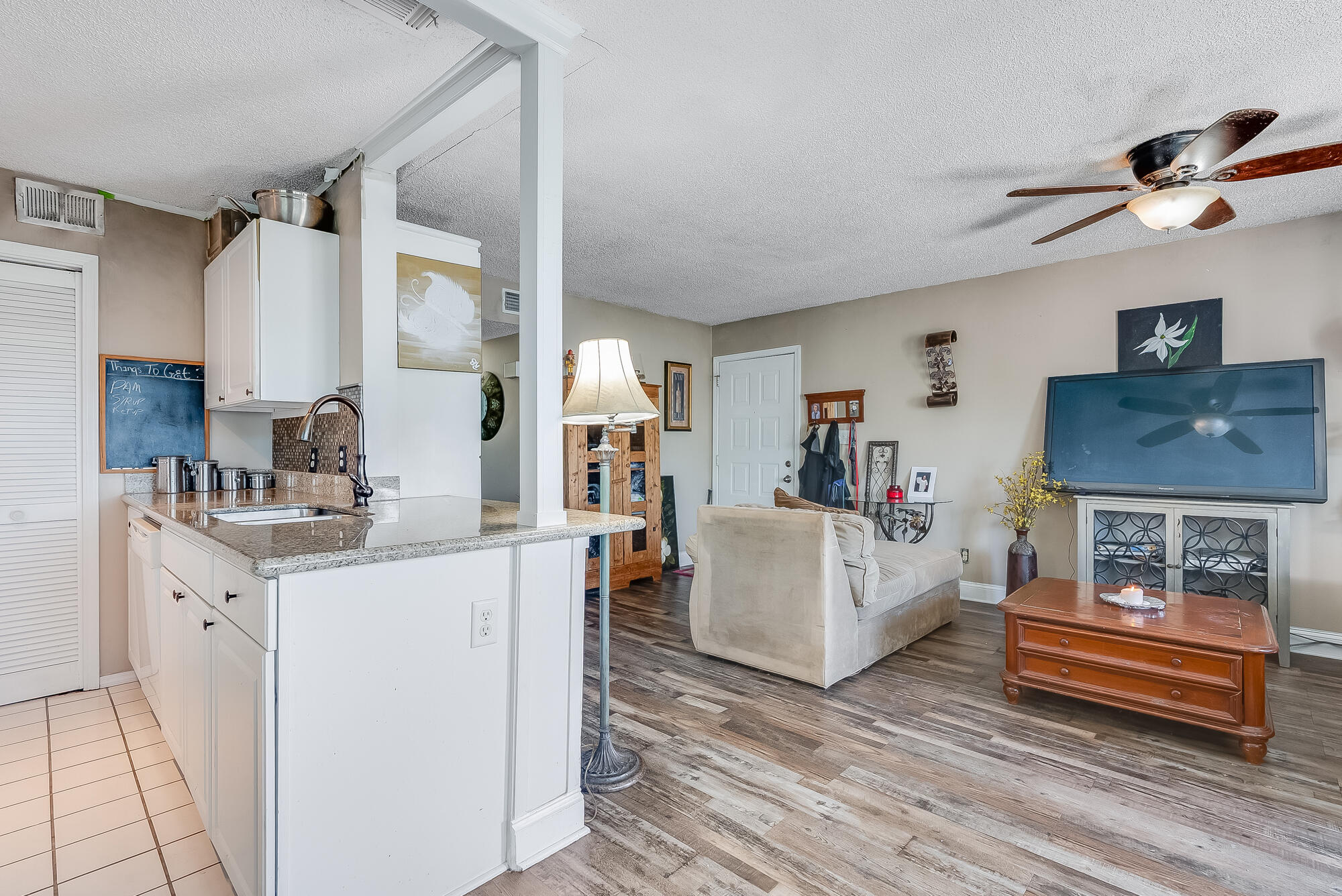 200 Pensacola Beach Road, Unit D2 Gulf Breeze, FL 32561 - Photo 15 of 38 a living room with furniture and a fireplace