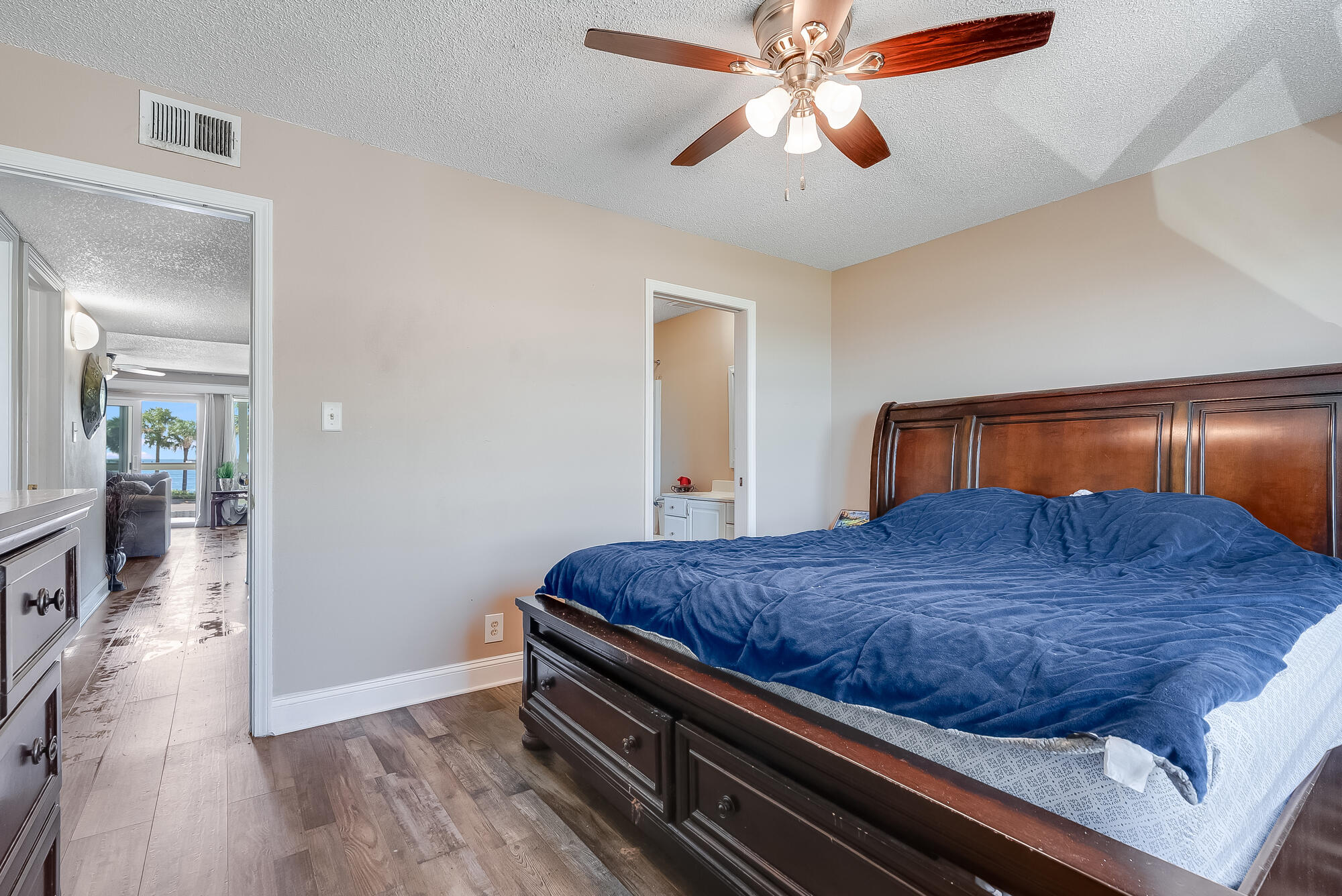 200 Pensacola Beach Road, Unit D2 Gulf Breeze, FL 32561 - Photo 17 of 38 a bedroom with bed and wooden floor