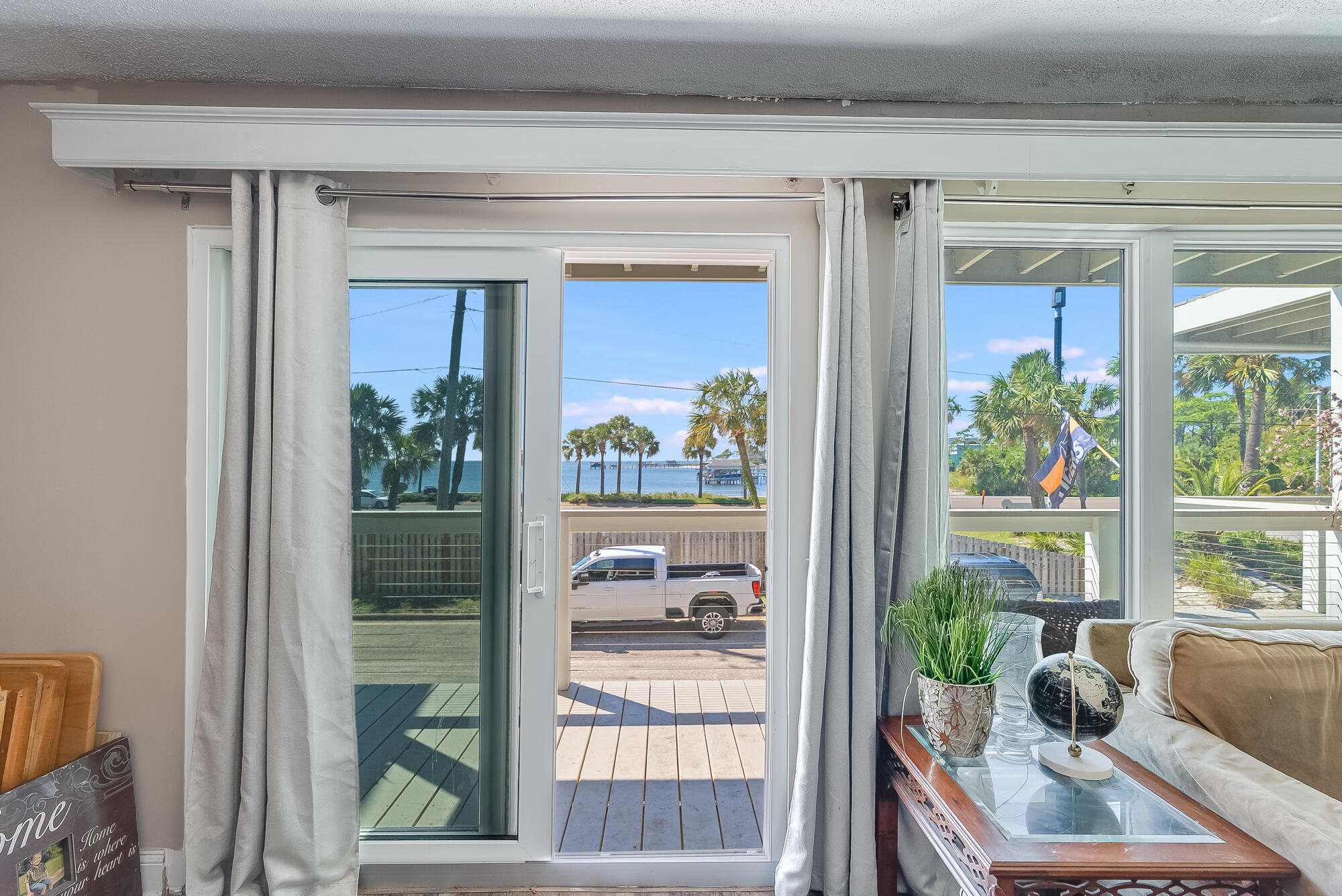 200 Pensacola Beach Road, Unit D2 Gulf Breeze, FL 32561 - Photo 7 of 38 a room with a couch and a potted plant