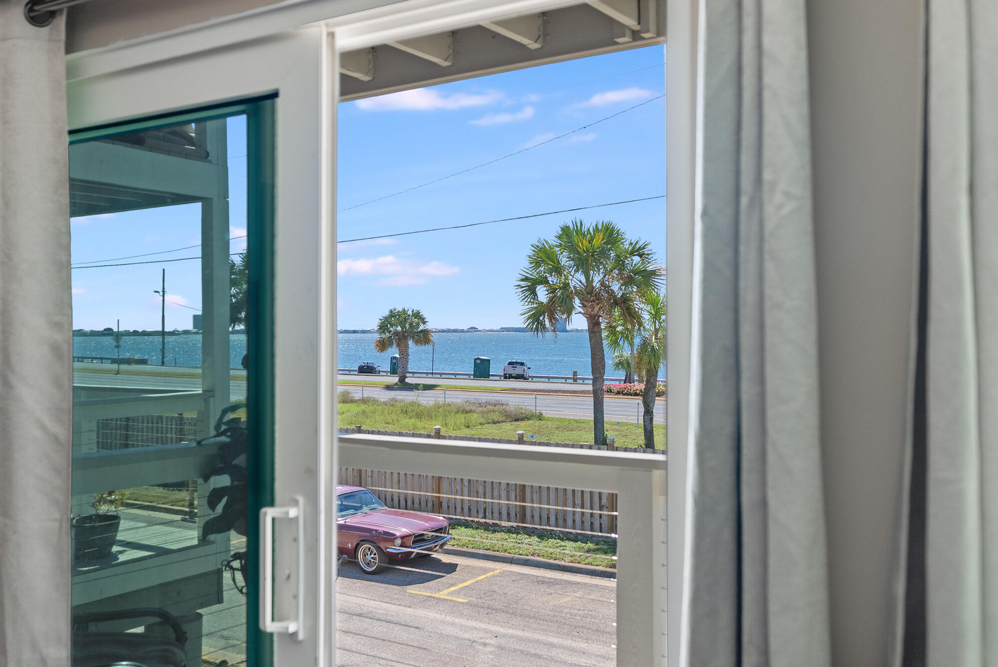 200 Pensacola Beach Road, Unit D2 Gulf Breeze, FL 32561 - Photo 9 of 38 a picture of a glass door