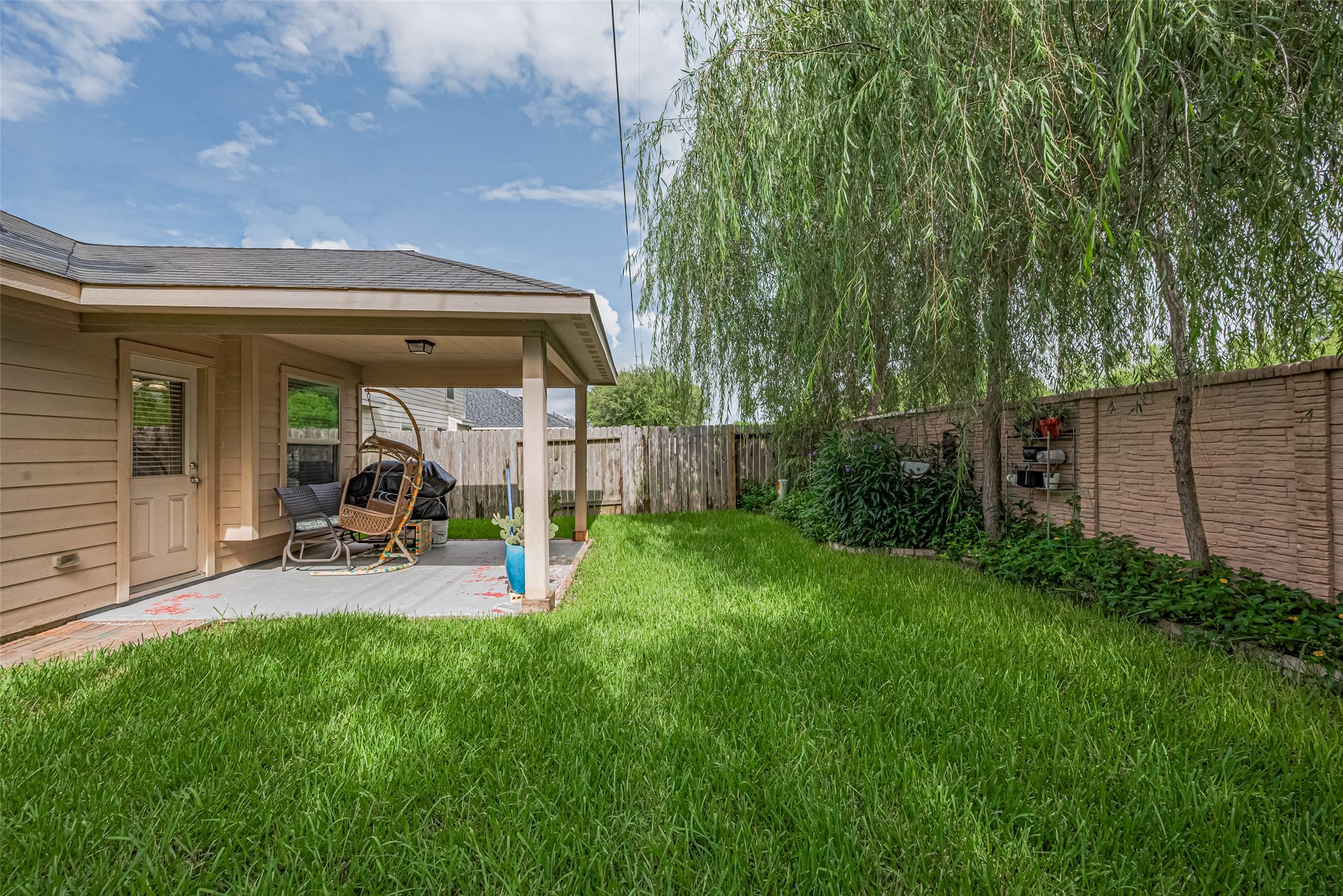 8219 Silent Deep Drive Rosenberg, TX 77469 - Photo 27 of 28 Backyard with covered patio